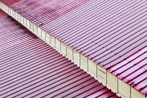 Red colored metal sheet roofing with a white diagonal line