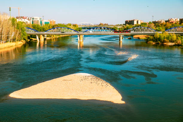 view of arch of stone bridge on Ebro river in Zaragoza city, Spain