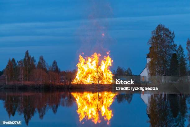 Swedish Holiday Bonfire To Celebrate Walpurgis Stock Photo - Download Image Now - Walpurgis, Sweden, Outdoors