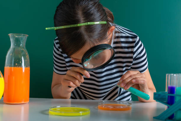 istock happy little girl  in chemistry class making experiments 1146862783