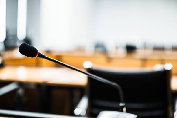 istock Microphone over the blurred business forum Meeting or Conference Training Learning Coaching Room Concept, Blurred background. 1146863648