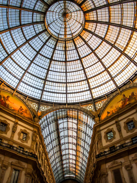 a suggestive view inside the dome of the galleria vittorio emanuele ii in the historic heart of milan - dome milan italy architectural feature italy imagens e fotografias de stock