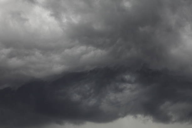 istock Dark thunderstorm cloud overcasting the moody sky for background design 1146867183