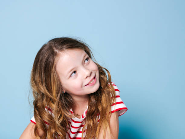 istock pretty girl with red white striped shirt 1146867645