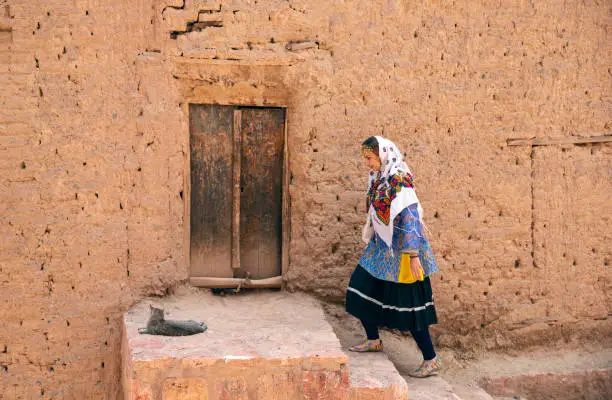 Photo of beautiful Iranian lady in a village of Abyaneh