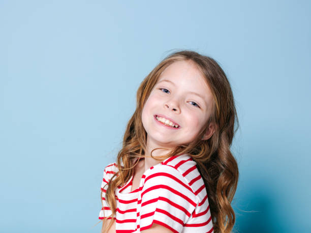 istock pretty girl with red white striped shirt 1146869647