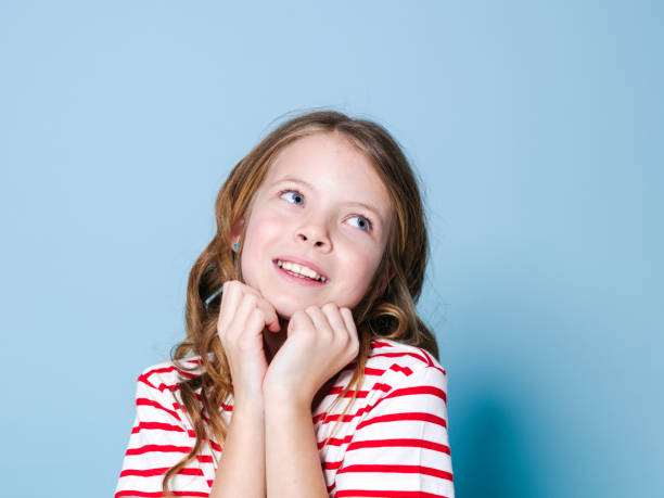 istock pretty girl with red white striped shirt 1146869810