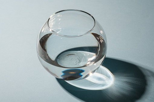 Sphere transparent vase with water isolated with shadow and highlights