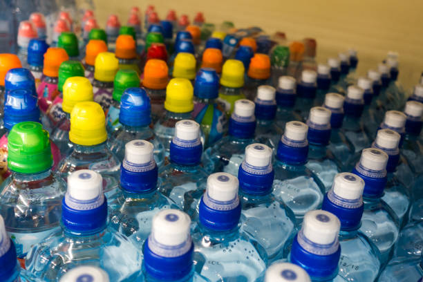 istock Lid plastic water bottle in the market. multi-colored plastic bottle caps 1146877246