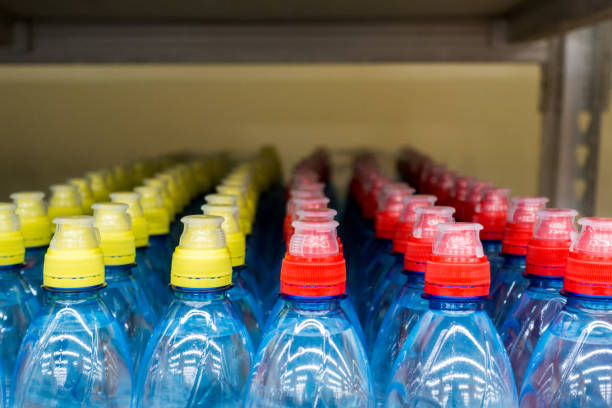 istock Lid plastic water bottle in the market. multi-colored plastic bottle caps 1146877762