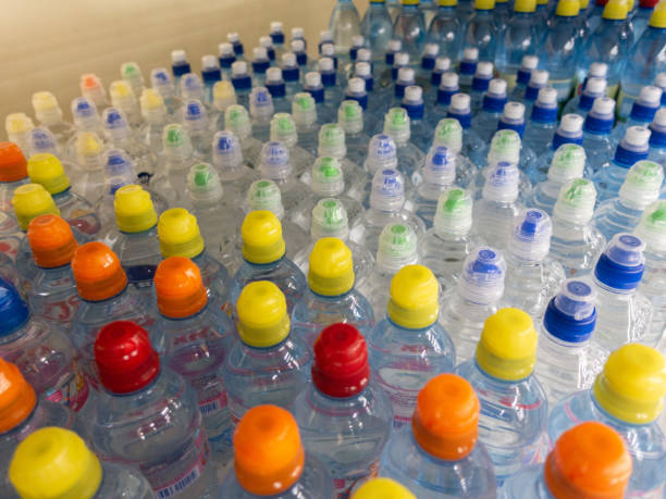 istock Lid plastic water bottle in the market. multi-colored plastic bottle caps 1146877768