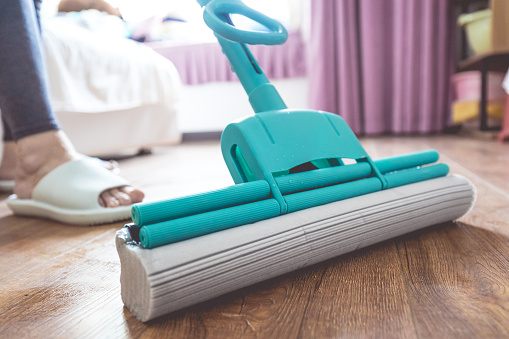 Cleaning floor with mop