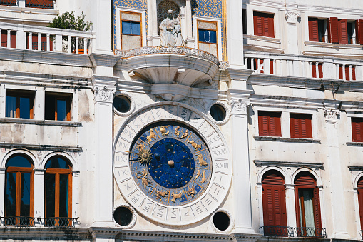 Close up of the blue clock at St Mark's Clocktower, Torre dell'orologio at St Mark's Square, Piazza San Marco, Venice, Italy. Details of facade.