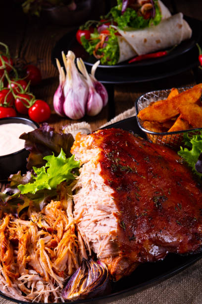 istock delicious pulled pork with baked potato quarters 1146883585