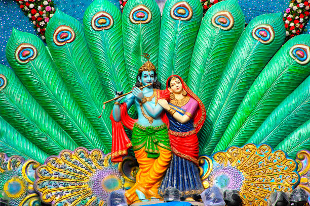 Sculpture of Radha Krishna and peacock feather during Dahi Handi festival, Pune Sculpture of Radha Krishna and peacock feather during Dahi Handi festival, Pune mahabharata stock pictures, royalty-free photos & images