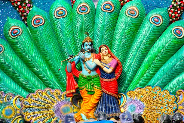 Sculpture of Radha Krishna and peacock feather during Dahi Handi festival, Pune