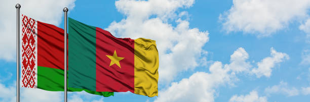 Belarus and Cameroon flag waving in the wind against white cloudy blue sky together. Diplomacy concept, international relations. Belarus and Cameroon flag waving in the wind against white cloudy blue sky together. Diplomacy concept, international relations. yaounde photos stock pictures, royalty-free photos & images