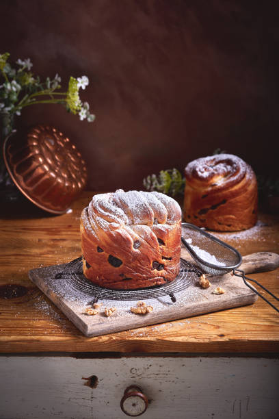 istock Panetone kulich craffin in vintage dark rustic scene. Easter bread kozunak. Wood table copy space concept. 1146886350