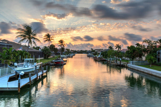 Riverway that leads to the ocean on Marco Island Riverway that leads to the ocean on Marco Island, Florida at Sunrise. marco island stock pictures, royalty-free photos & images