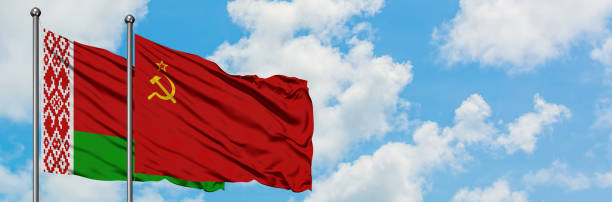 istock Belarus and Soviet Union flag waving in the wind against white cloudy blue sky together. Diplomacy concept, international relations. 1146886584
