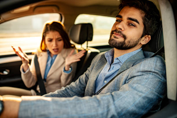 istock A man driving while a female passenger is fussing about 1146888185