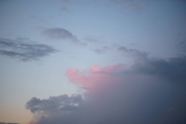 Pink vivid sunset with a mill in the background - Rainy clouds taking over in this beautiful landscape scenery of our nature Pink vivid sunset with a mill in the background - Rainy clouds taking over in this beautiful landscape scenery of our nature - Colorful sunrise - Video footage from this set is available too. dorchester on thames stock pictures, royalty-free photos & images