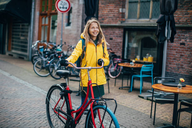 istock Dutch woman with bicycle in Amsterdam 1146893920