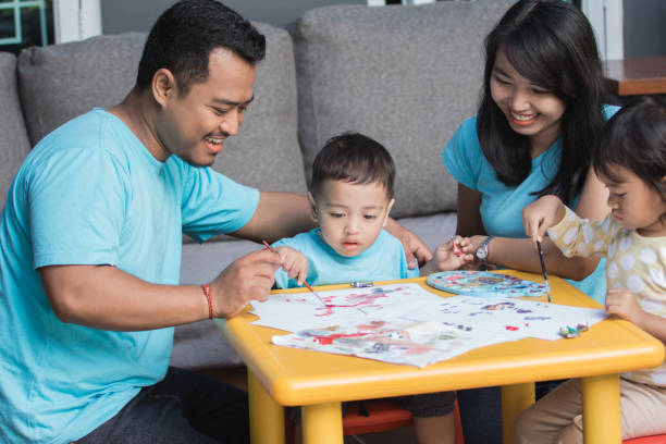 istock asian kid painting and drawing 1146894079