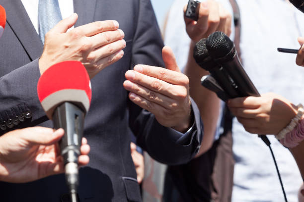 istock Business person or politician gesturing during press conference 1146896062