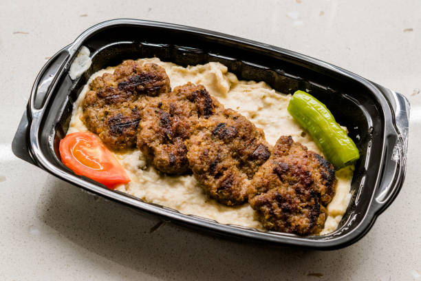 Turkish Fast Food Kofte / Kofta with Roasted Eggplant Hunkar Begendi in Plastic Cup / Container. (Aubergine Kebab or Kebap) Turkish Fast Food Kofte / Kofta with Roasted Eggplant Hunkar Begendi in Plastic Cup / Container. (Aubergine Kebab or Kebap). Traditional Meat Food. hunkar begendi stock pictures, royalty-free photos & images