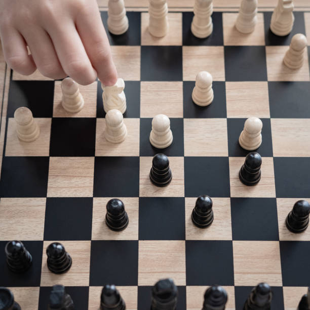 istock a girl learn how to play chess game 1146900010