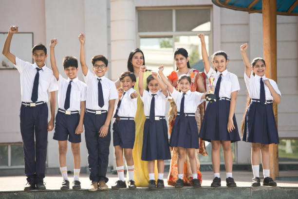 istock Teachers with students celebrating success 1146902319