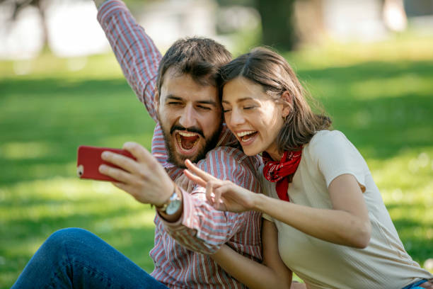 istock Young Attractive Couple is Having Fun in the Public Park 1146903610