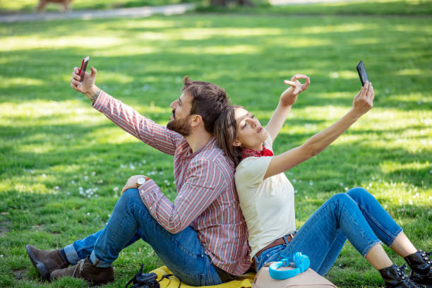 istock Young Attractive Couple is Having Fun in the Public Park 1146904458