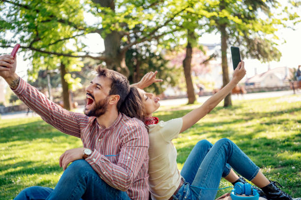 istock Young Attractive Couple is Having Fun in the Public Park 1146905105