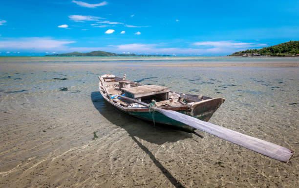 istock Fishery wooden boat at the shore. 1146910864