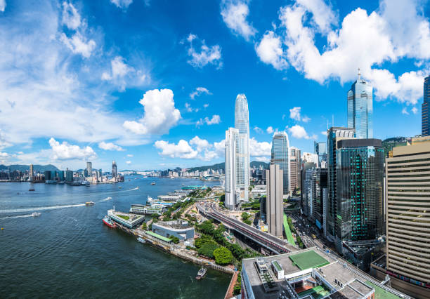 View of the Hong Kong skyline. Hong Kong, Victoria Harbour - Hong Kong, Hong Kong Island, Urban Skyline, Asia brics photos stock pictures, royalty-free photos & images