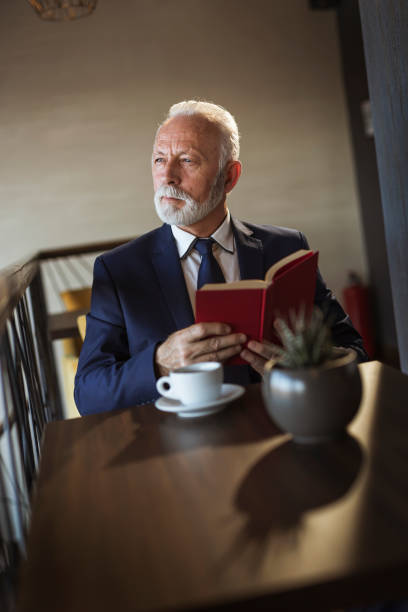 istock Senior businessman reading a book 1146912028