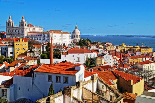 Alfama district, São Vicente de Fora church and the National Pantheon Alfama is one of the popular districts in Lisbon that kept its authenticity national pantheon lisbon stock pictures, royalty-free photos & images