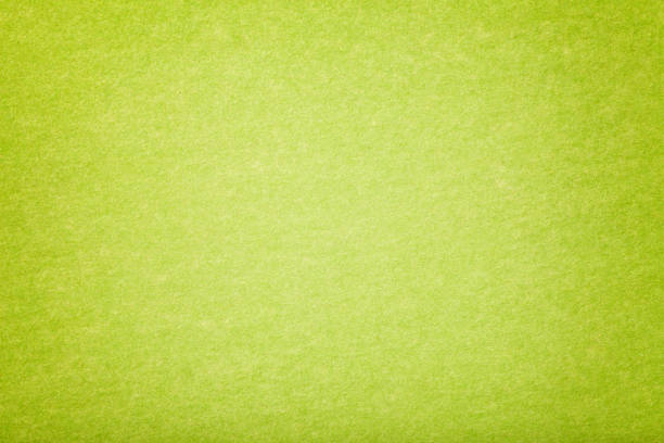 light green matt suede fabric closeup. velvet texture of felt. - lime green imagens e fotografias de stock