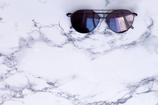 istock White marble texture with black sunglasses shadow and background for design pattern artwork, modern concept of natural organic trend. 1146913500