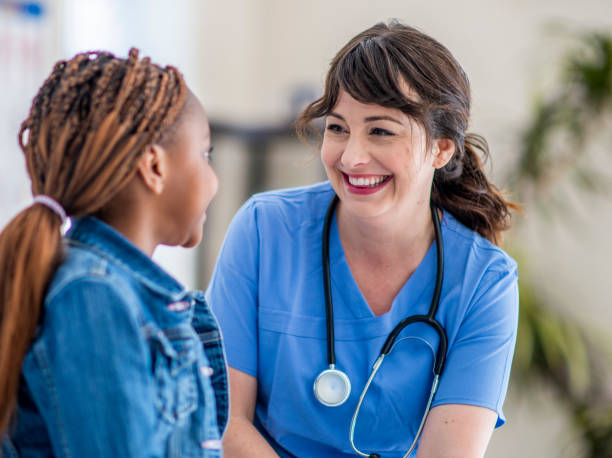 istock Smiling little girl at doctor's office 1146913646