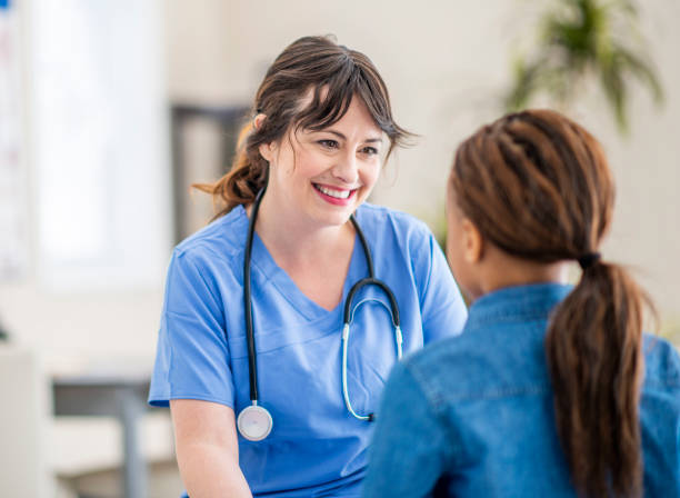 istock Smiling little girl at doctor's office 1146913656