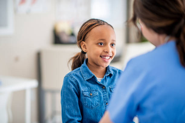 istock Smiling little girl at doctor's office 1146913683