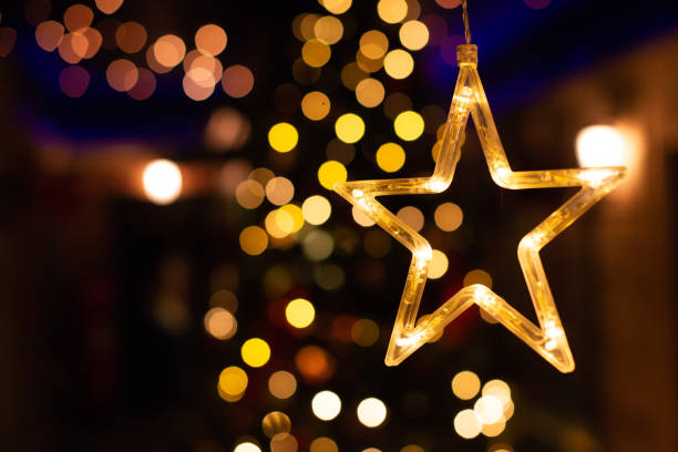 istock Star decoration, New year light bokeh, Yellow decor lights 1146913768