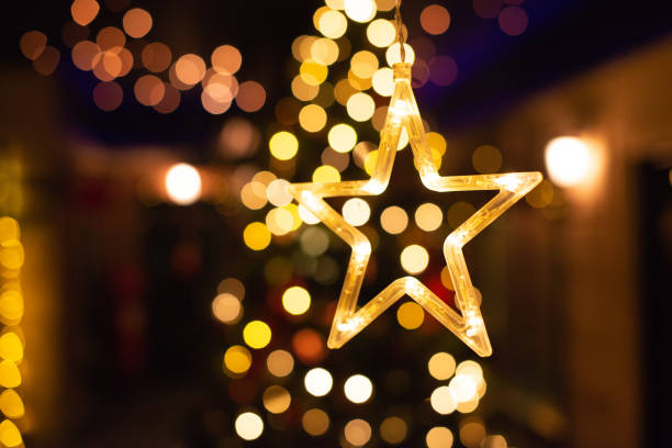 istock Star decoration, New year light bokeh, Yellow decor lights 1146913805