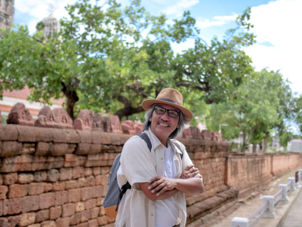 istock Retired walking around the town with a map. summer traveler concept. 1146914807