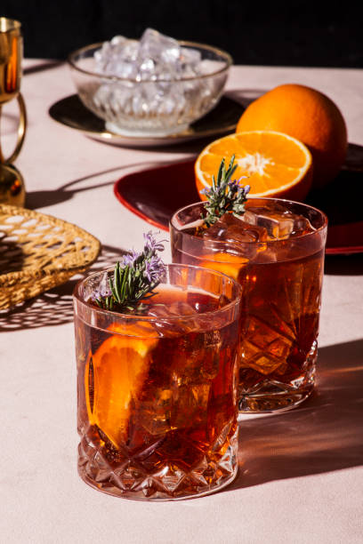 Negroni, a popular Italian cocktail Negroni, an Iba cocktail, with 1/3 gin, 1/3 bitter, 1/3 vermut, in luxury pop style, rich and colorful. vermouth stock pictures, royalty-free photos & images