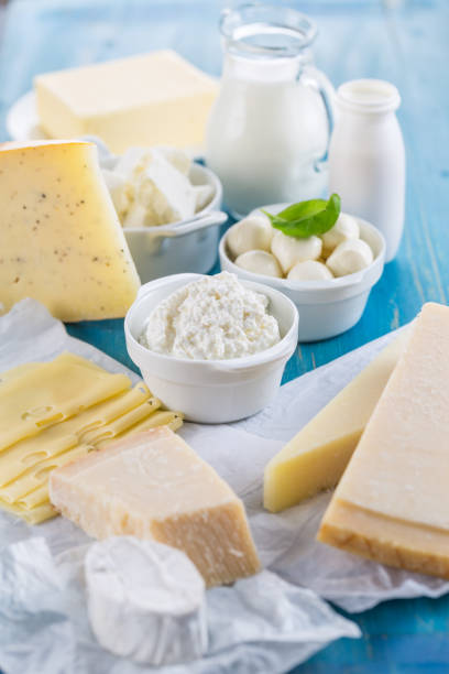 Different types of dairy products on wooden background