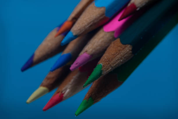 istock Beautiful multi-colored pencil in water on a blue background. 1146920922